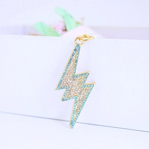 Golden lightning bolt keychain with gradient blue and white rhinestones for bags