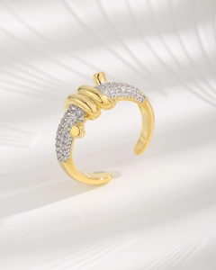 Detailed view of gold knot ring with micro-pave zircons and adjustable open band