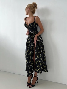 Detail of floral sundress featuring adjustable drawstring bust and high side slit