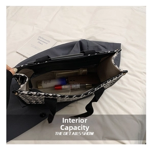 Top view showing the spacious interior of a vintage houndstooth tote with zipper pocket