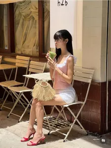 Pink checkered camisole with ruffle straps and front buttons for a sweet summer look