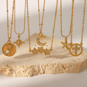 Golden titanium steel necklaces with zircon moon, star, and cross pendants on stone base