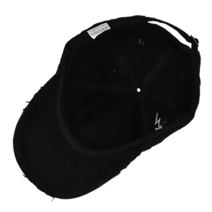 Detail of internal cotton stitching and adjustable metal buckle on black baseball cap