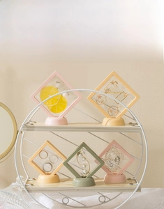 Detail view of PE film jewelry storage boxes with round bases in various pastel colors