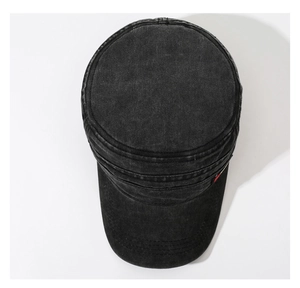 Top view of a black washed denim flat top military cap with vintage distressed texture