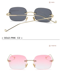 Detail of gold frameless sunglasses showing pink gradient lenses and metal temple arms