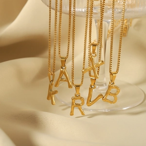 Artistic 18k gold plated titanium steel initial necklaces with bamboo style pendants