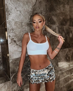 Detail of white ribbed tank top and silver sequin mini skirt set for party wear