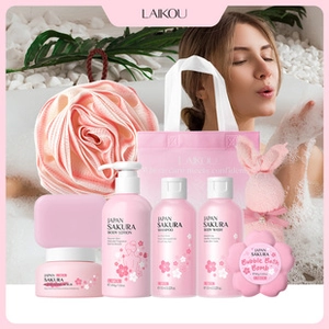 Pink cherry blossom bath and body spa gift set with skin care products in macro detail