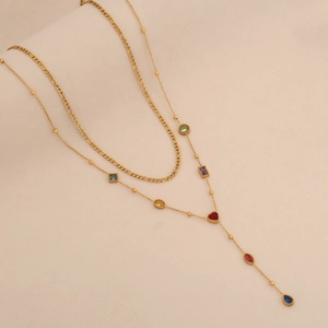Detail of gold double-layer Y-shaped necklace with colorful glass gemstone charms