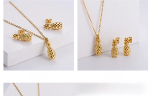 Detail of gold pineapple jewelry set featuring a delicate necklace and matching stud earrings