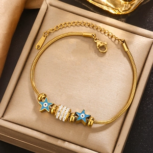 Gold plated stainless steel snake chain bracelet with blue star evil eye charms