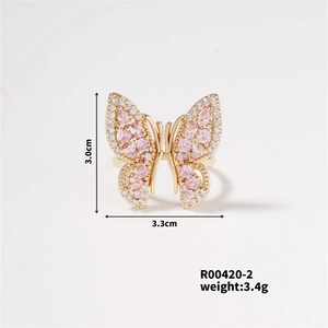 Detail shot showing butterfly ring dimensions 3.0cm by 3.3cm and 3.4g weight specifications