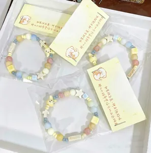 Handgemachte Keramikperlen-Armbänder in Makronenfarben mit niedlichen Elefanten-Anhängern