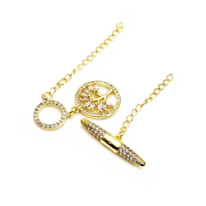Detail of gold-plated OT toggle clasp with cubic zirconia and Tree of Life pendant