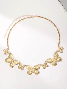 Detailed view of bohemian golden butterfly waist chain with adjustable lobster clasp