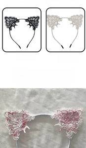 Close-up of black and white lace cat ear headbands with intricate gothic texture detail
