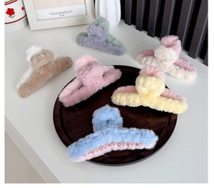 Group shot of large plush hair claws in six soft pastel colors for elegant styling