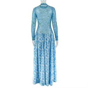 Detail of blue tropical leaf print on lightweight mesh long sleeve maxi dress