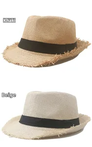 Detail view of khaki and cream straw fedora hats with black ribbons and frayed edges
