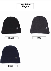 Detailed knit beanie view in black, grey, and blue colors with sports logo patch