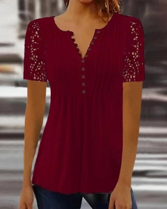 Detail of burgundy V-neck top showing button placket and lace hollow-out sleeve design