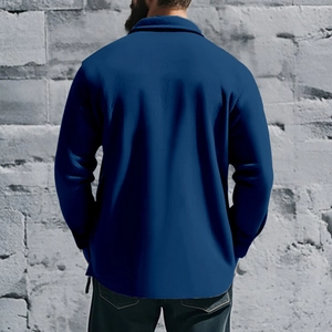 Back view of a navy blue slim fit jacket showing the tailored cut and cotton fabric