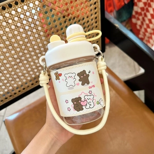 Detail of cute bear pattern on white leather sleeve for portable plastic straw cup