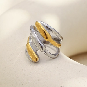 Detailed macro view of 18K gold and silver plated multi-layer geometric ring design