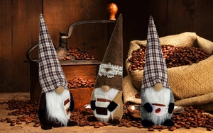 Detailed view of three coffee-themed Christmas gnomes with mini cups and burlap bean bags