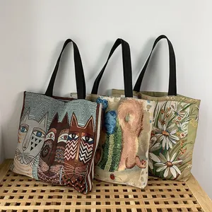 Detail of woven jacquard canvas tote bags with cat, squirrel, and daisy patterns
