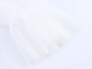 Detail of white layered mesh sleeve cuffs with pleated tulle ruffles and soft texture