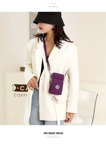 Detail of purple nylon crossbody phone bag with multi-layer zippers and strap