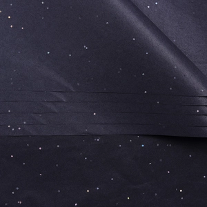 Macro shot of dark blue glitter silk paper for bouquet wrapping with shiny laser sequins