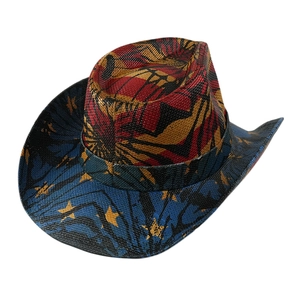 Detail view of woven cowboy hat featuring American flag star pattern and straw texture