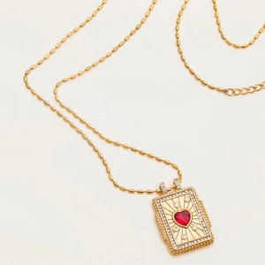 Detail of 18K gold plated beaded chain and tarot-style pendant with red heart stone
