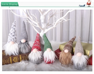 Close-up of six Nordic Christmas gnomes with knitted hats and fluffy beards on white fur