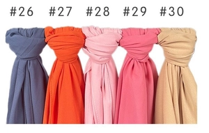 Detailed close-up showing five colored pearl chiffon scarves in hanging folded knots