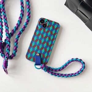 Detail view of colorful geometric cube pattern phone case with matching braided lanyard
