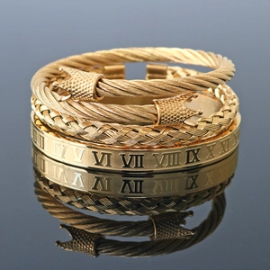 Three-piece set of gold stainless steel bracelets featuring Roman numerals and crown charms