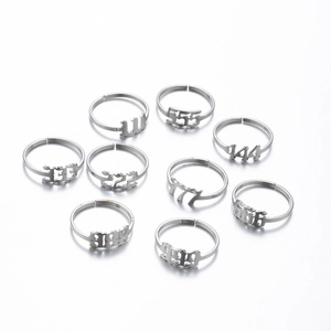 Set of nine stainless steel angel number rings from 111 to 999 with adjustable open bands