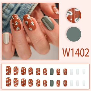 Olive green and brick red press-on nails set with heart patterns and glossy finish