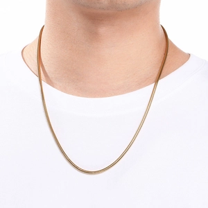 Detail of 18K gold-plated stainless steel snake chain worn on model with white background