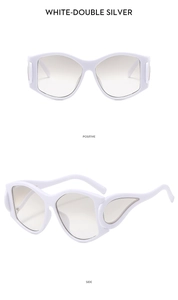 Detail of white Y2K sunglasses featuring silver wing-shaped flame patterns on the side