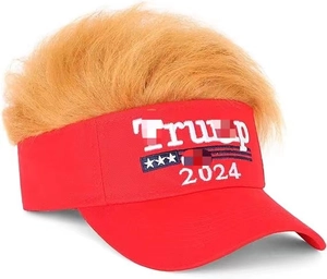 Close-up of red baseball cap with Trump 2024 embroidery and blonde synthetic hair on top