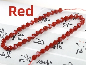 Detailed view of faceted natural red agate beads for handmade jewelry DIY bracelets