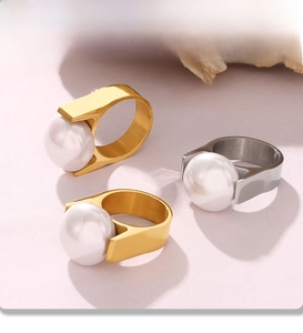 Detailed PVD electroplated gold and silver rings with large white round pearls