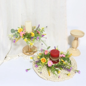 Detail of pink and yellow daisy candle ring with lavender for wedding table decor