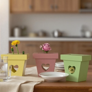 Set of three heart-shaped cutout resin planters in yellow, pink and green for DIY decor