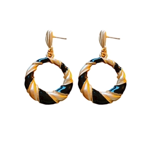 Vintage gold and black enamel twisted hoop earrings with a retro spiral design for women